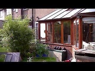 Susan cleaning the windows naked