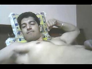 Indian guy cums while flexing muscles
